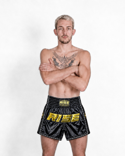 RISE MUAY THAI SHORTS SATIN (BLACK/GOLD)