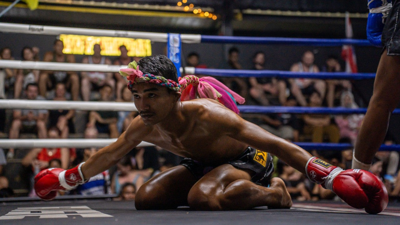 Fighter is doing the "wai kru" inside the ring